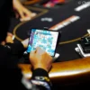 Can Banning Phones at the Poker Table Really Stop Cheating Scandals?